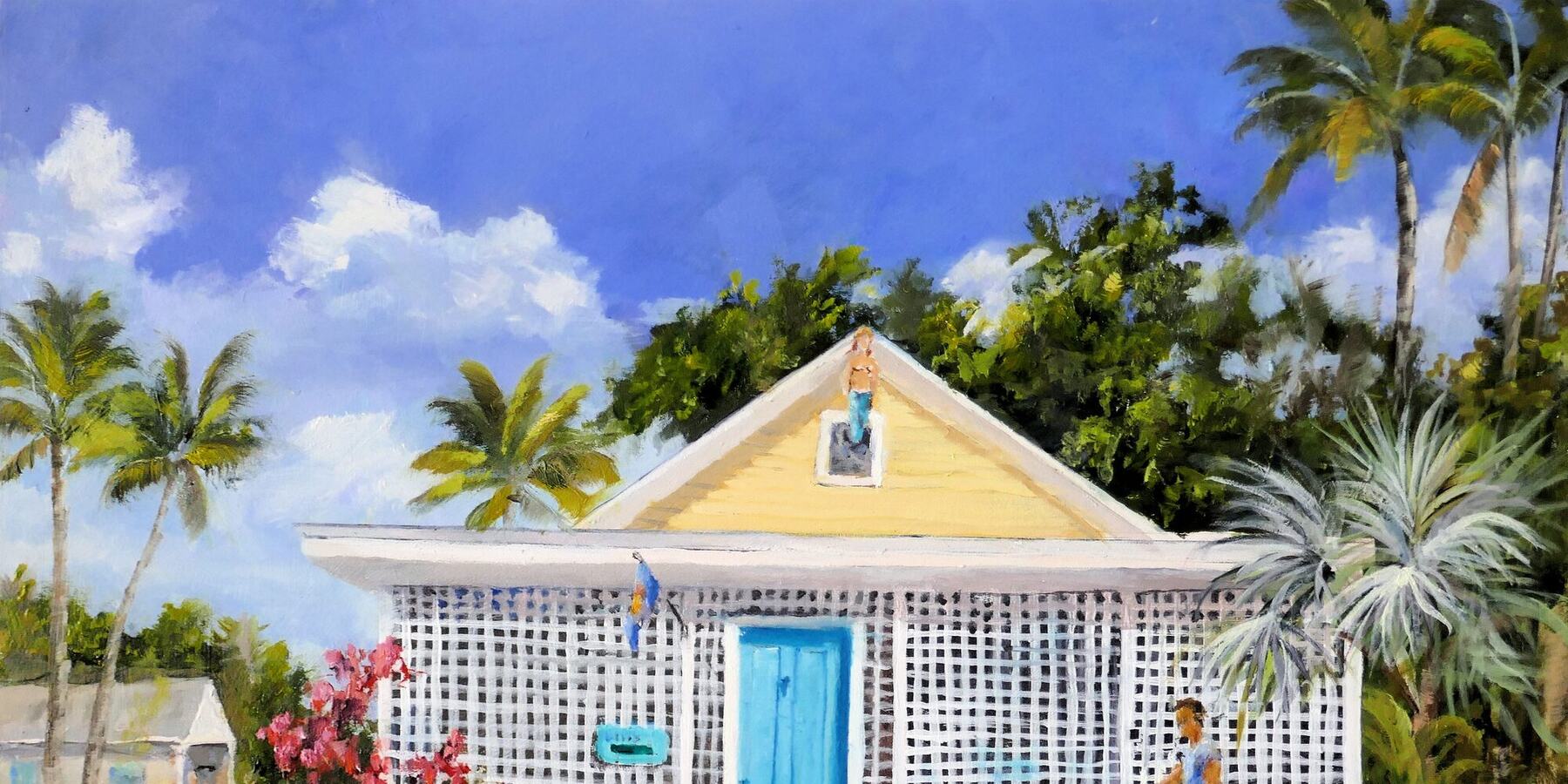 A pale yellow conch cottage with a bright blue door, white gingerbread trim and flowering bougainvillea.